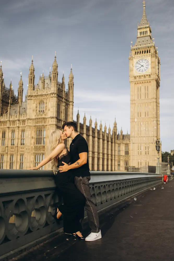 Couple on Westminster Bridge in morning light with Big Ben and the Houses of Parliament