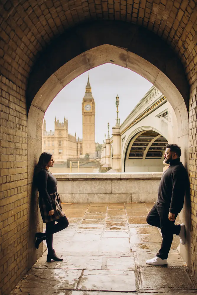 Couple under the Westminster Bridge arch during a Big Ben photoshoot