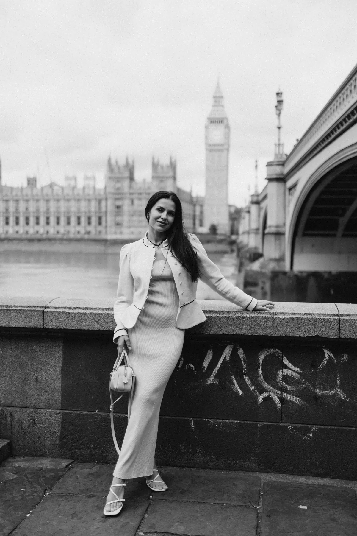Black and white portrait on the river wall with Big Ben and Westminster Bridge