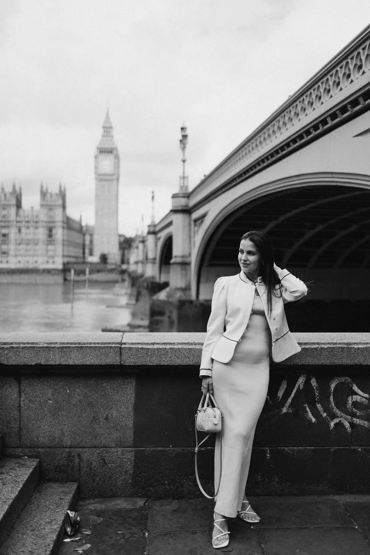 Black and white portrait under Westminster Bridge with Big Ben in the distance